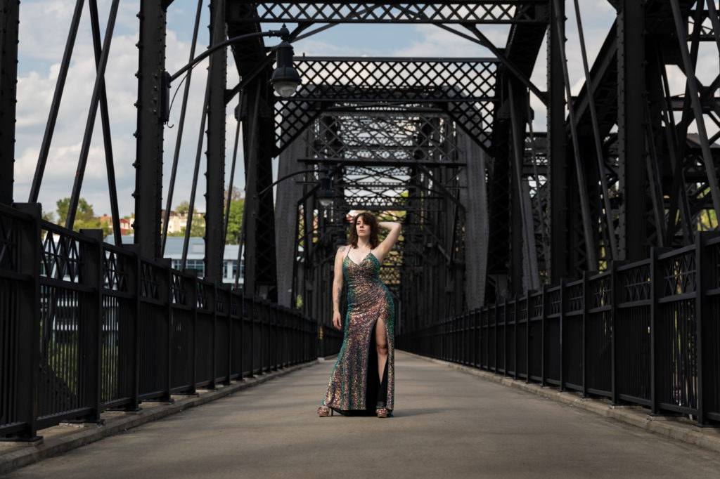 Natalie Vaia posing on the Hot Metal Bridge in urban Pittsburgh